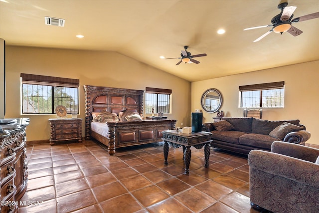 tiled bedroom with lofted ceiling, multiple windows, and ceiling fan