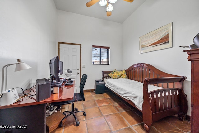 bedroom featuring ceiling fan, lofted ceiling, and tile patterned flooring