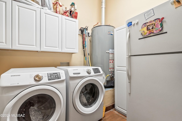 washroom featuring cabinets, independent washer and dryer, and gas water heater