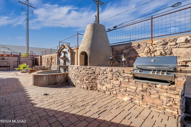 view of patio with a grill