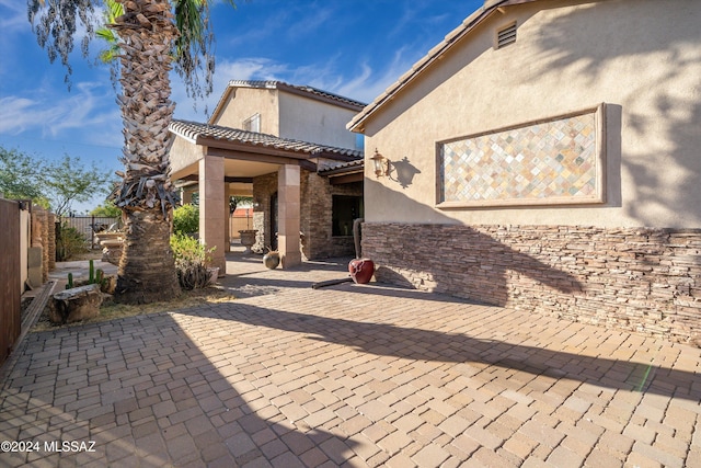 rear view of house featuring a patio area