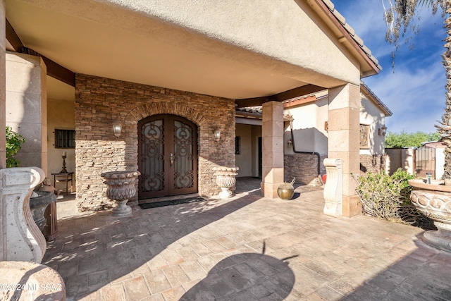 entrance to property with a patio area