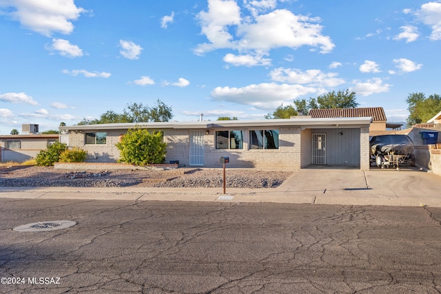 ranch-style home with a carport