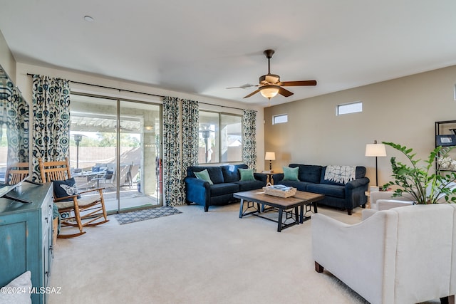 living room with light carpet and ceiling fan