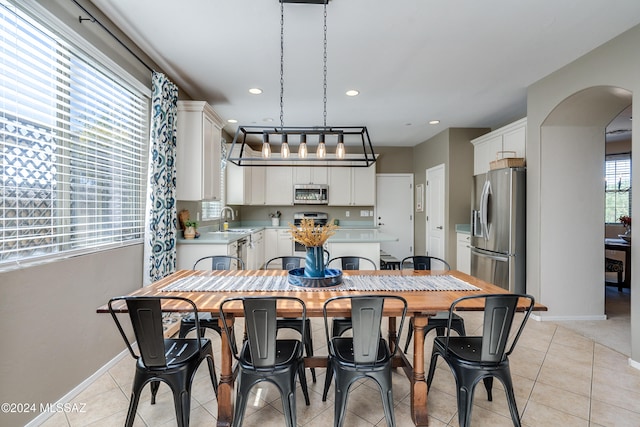 tiled dining area with sink