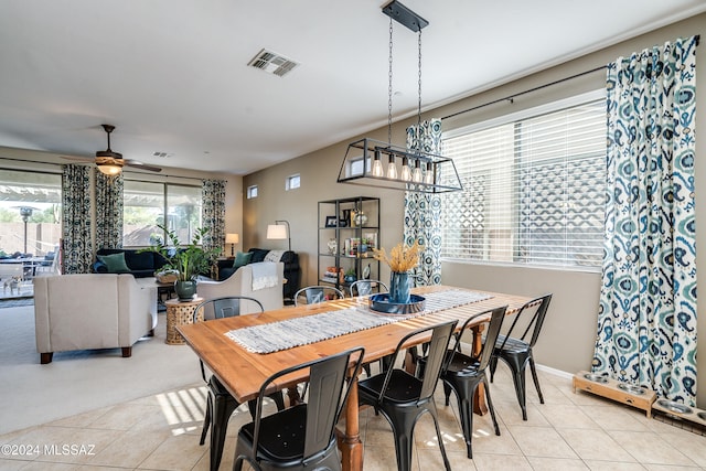 dining room featuring light tile patterned floors and ceiling fan