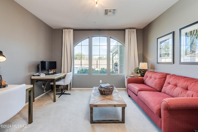 living room featuring light carpet