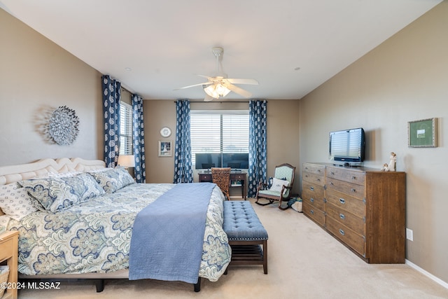 bedroom with light carpet and ceiling fan