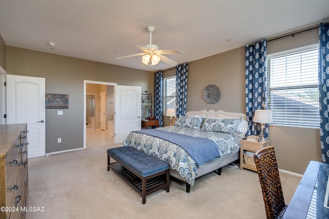 carpeted bedroom featuring ceiling fan and multiple windows