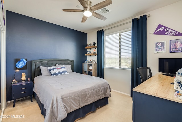 carpeted bedroom with ceiling fan