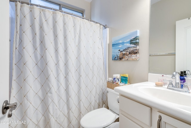 bathroom with vanity, toilet, and a shower with shower curtain