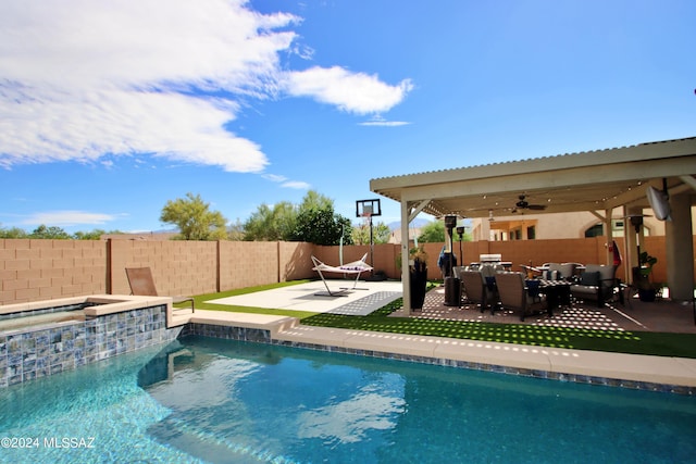 view of pool with a hot tub, a patio area, outdoor lounge area, and ceiling fan