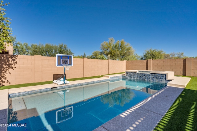 view of swimming pool featuring an in ground hot tub