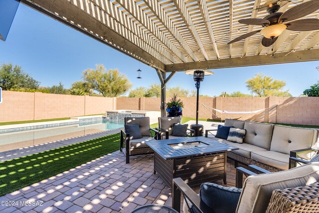 view of patio / terrace featuring an outdoor hangout area, a pergola, a fenced in pool, and ceiling fan