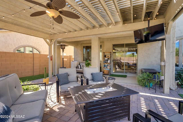 view of patio / terrace with an outdoor living space, a pergola, and ceiling fan