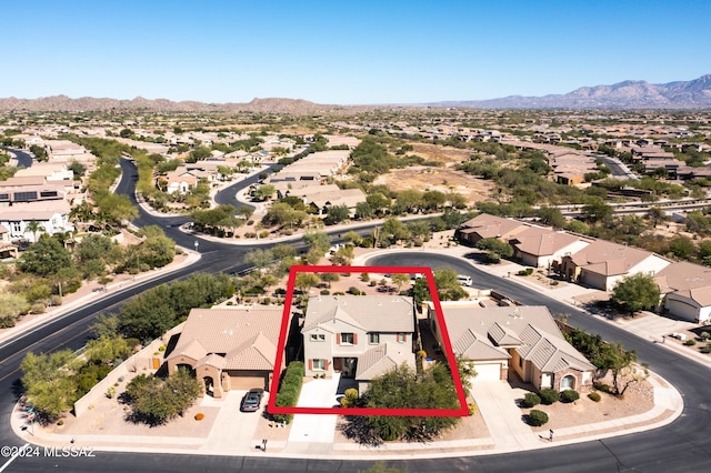 birds eye view of property featuring a mountain view