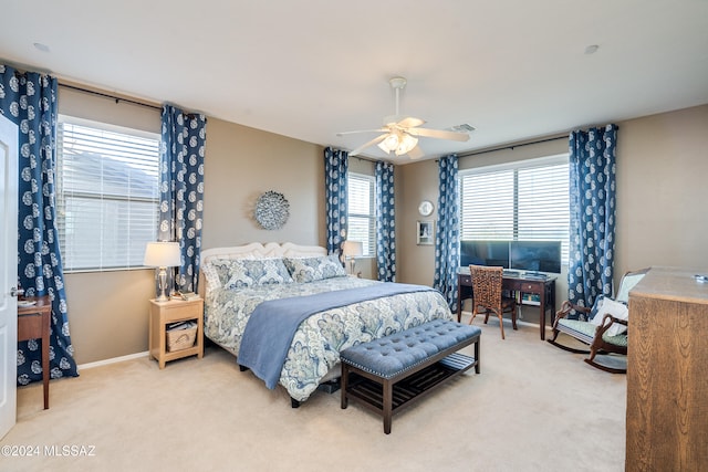 bedroom with light colored carpet and ceiling fan