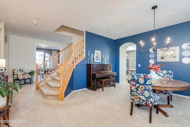 carpeted dining area with a notable chandelier