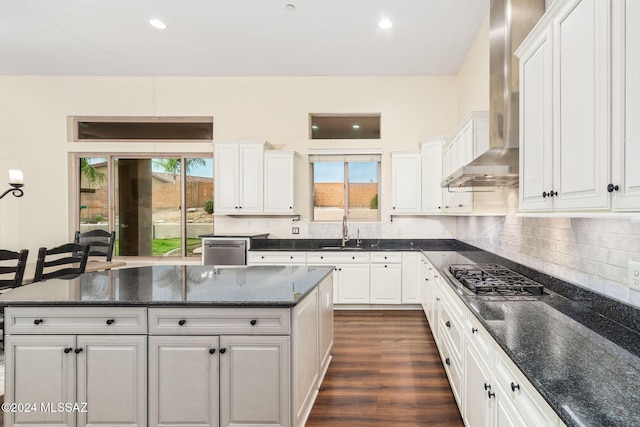 1220 W Calabria Ct, Tucson, AZ 85755 - kitchen featuring wall chimney range hood, appliances with stainless steel finishes, a sink, white cabinetry, and recessed lighting