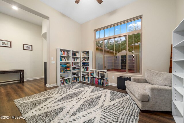 sitting room featuring dark hardwood / wood-style flooring and ceiling fan