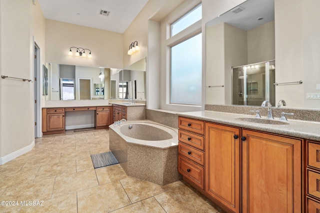 1220 W Calabria Ct, Tucson, AZ 85755 - full bathroom featuring a stall shower, a bath, two vanities, and tile patterned floors