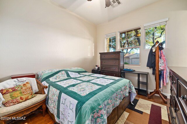 bedroom featuring dark hardwood / wood-style floors and ceiling fan