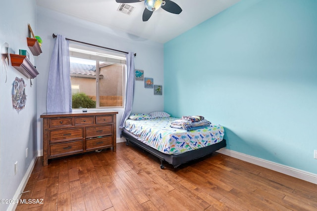 1220 W Calabria Ct, Tucson, AZ 85755 - bedroom with wood-type flooring, baseboards, and ceiling fan