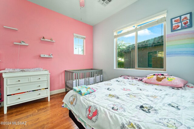 bedroom with wood-type flooring