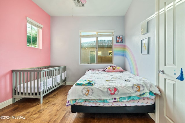 1220 W Calabria Ct, Tucson, AZ 85755 - bedroom featuring wood finished floors and baseboards
