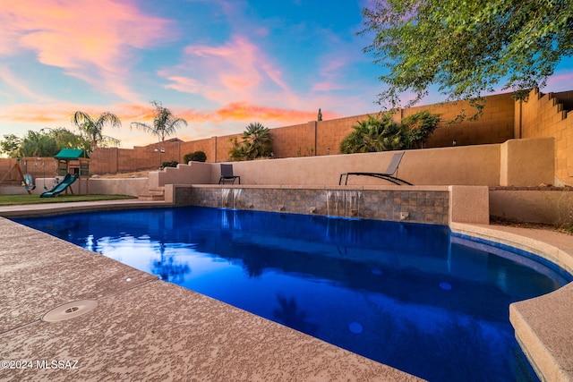 1220 W Calabria Ct, Tucson, AZ 85755 - view of swimming pool with a fenced backyard and a playground