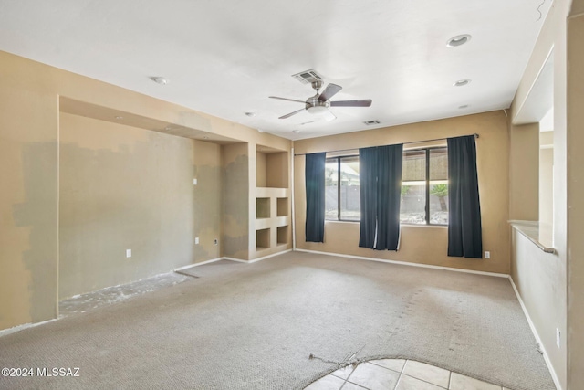 carpeted empty room with ceiling fan