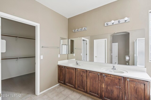 bathroom with tile patterned flooring and vanity