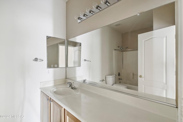 full bathroom featuring vanity, toilet, and tiled shower / bath