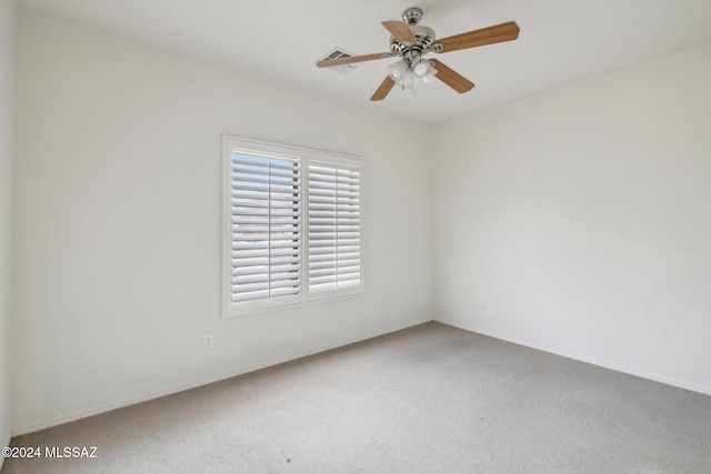 spare room with carpet flooring and ceiling fan