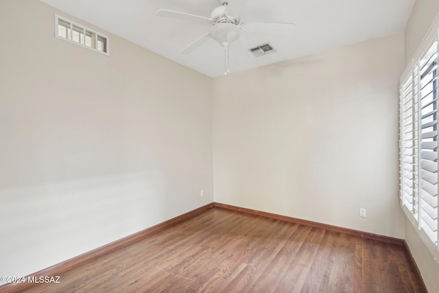 empty room featuring hardwood / wood-style floors and ceiling fan