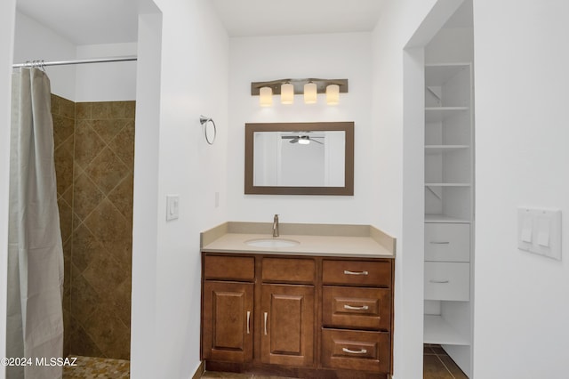 bathroom featuring vanity, tile patterned floors, curtained shower, and ceiling fan