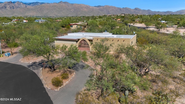 birds eye view of property with a mountain view