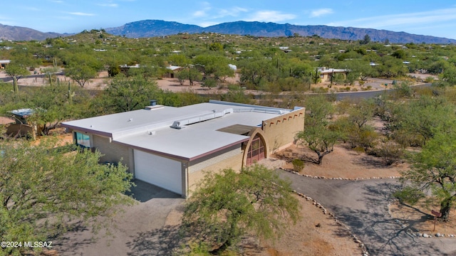 birds eye view of property featuring a mountain view