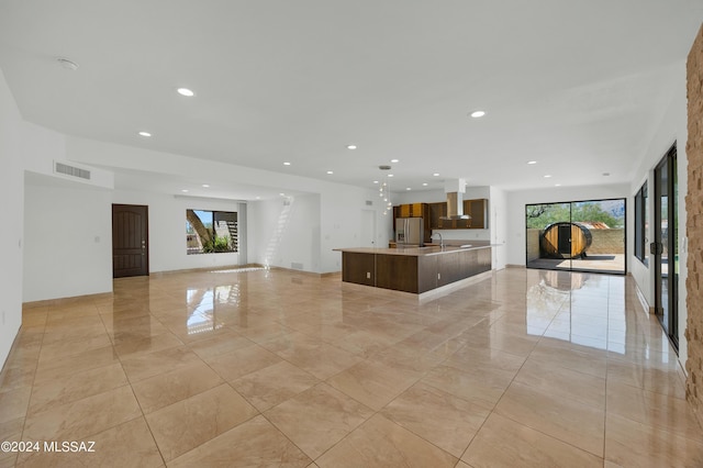 unfurnished living room with sink