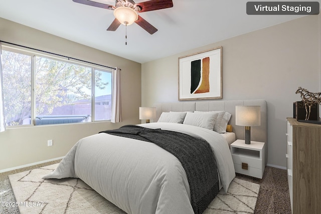 carpeted bedroom featuring ceiling fan