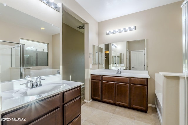 bathroom featuring tile patterned floors, vanity, and independent shower and bath