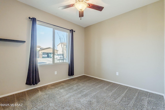 empty room featuring ceiling fan and carpet floors