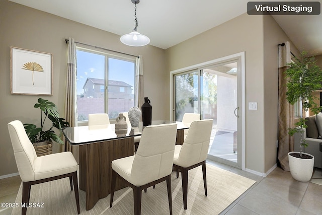 dining area with plenty of natural light and light tile patterned floors