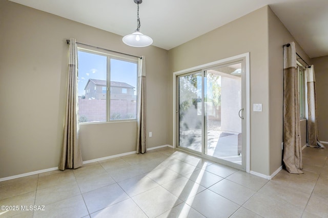 interior space featuring plenty of natural light and light tile patterned flooring