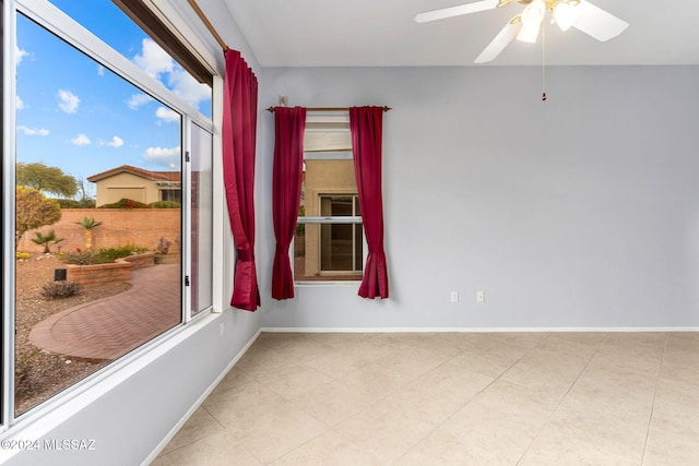 unfurnished room featuring ceiling fan