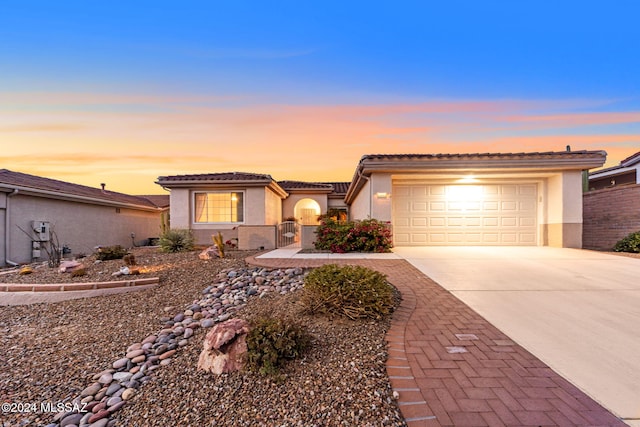 view of front of home with a garage