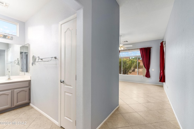 corridor with light tile patterned floors