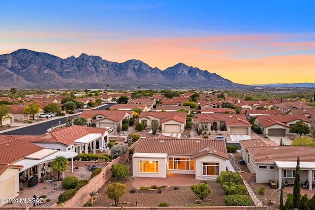 aerial view at dusk with a mountain view