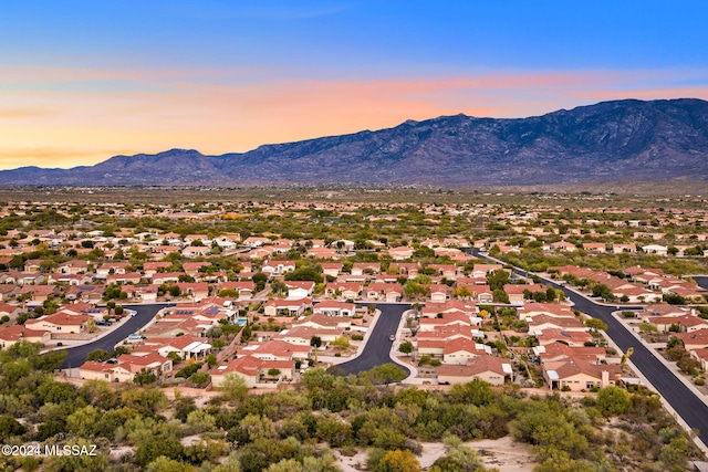 aerial view at dusk with a mountain view