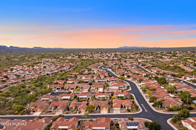 aerial view at dusk with a mountain view